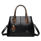 Sac Boston Sienna noir serpent porté épaule bandoulière
